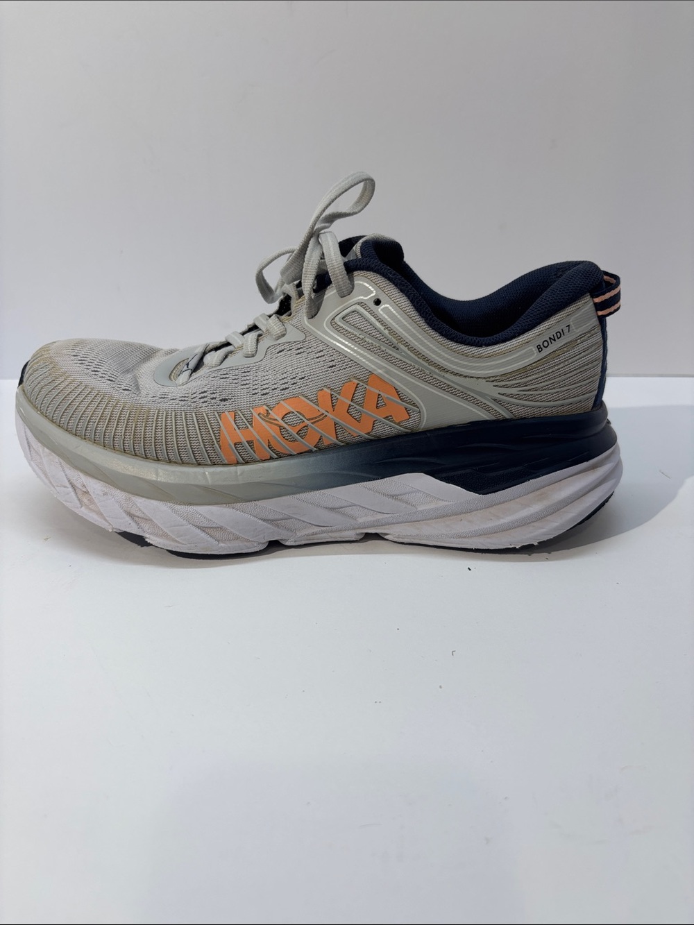 Hoka women’s size 7 gray/peach Bindi 7 style #110531 LRBI in fair condition.